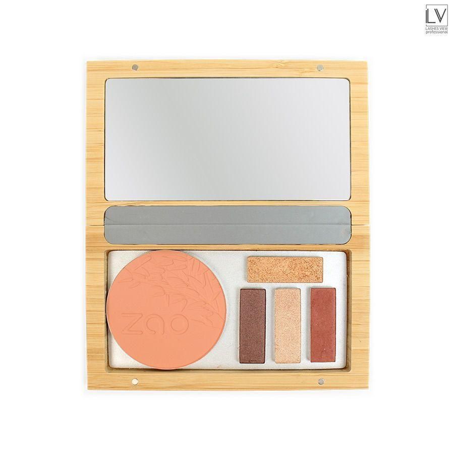 Geöffnete Bambusbox mit Spiegel, Puder und Lidschatten. Verschiedene Farbtöne. Natürliche Holzfarbe.