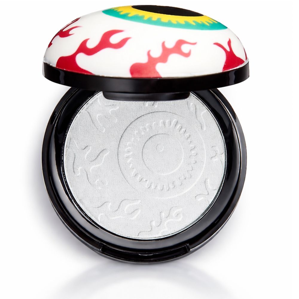 Geöffneter, runder Behälter mit Augenmotiv. Weißer Highlighter mit Augenmuster. Schwarzer Rand.