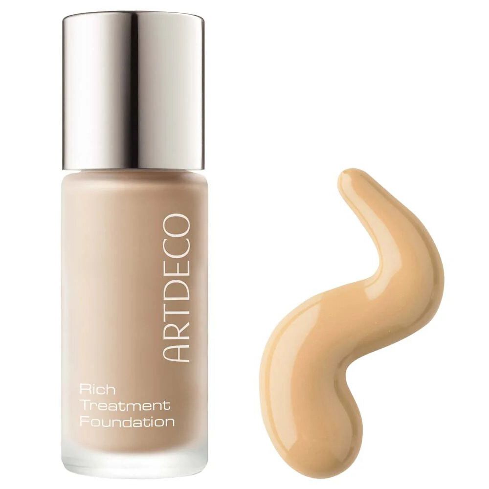 Artdeco Rich Treatment Foundation. Flasche mit silbernem Deckel und Produktprobe. Marke und Produktname sichtbar.