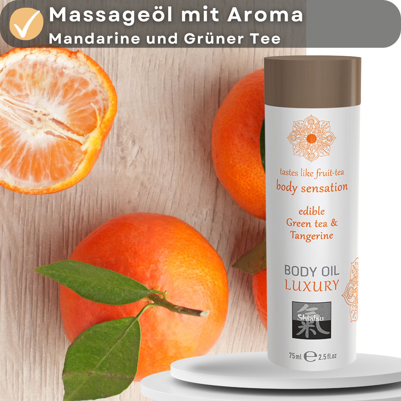 Massageöl-Flasche neben Mandarinen. Text: Massageöl mit Aroma Mandarine und Grüner Tee, body sensation, Green tea & Tangerine, BODY OIL LUXURY, Shiatsu.