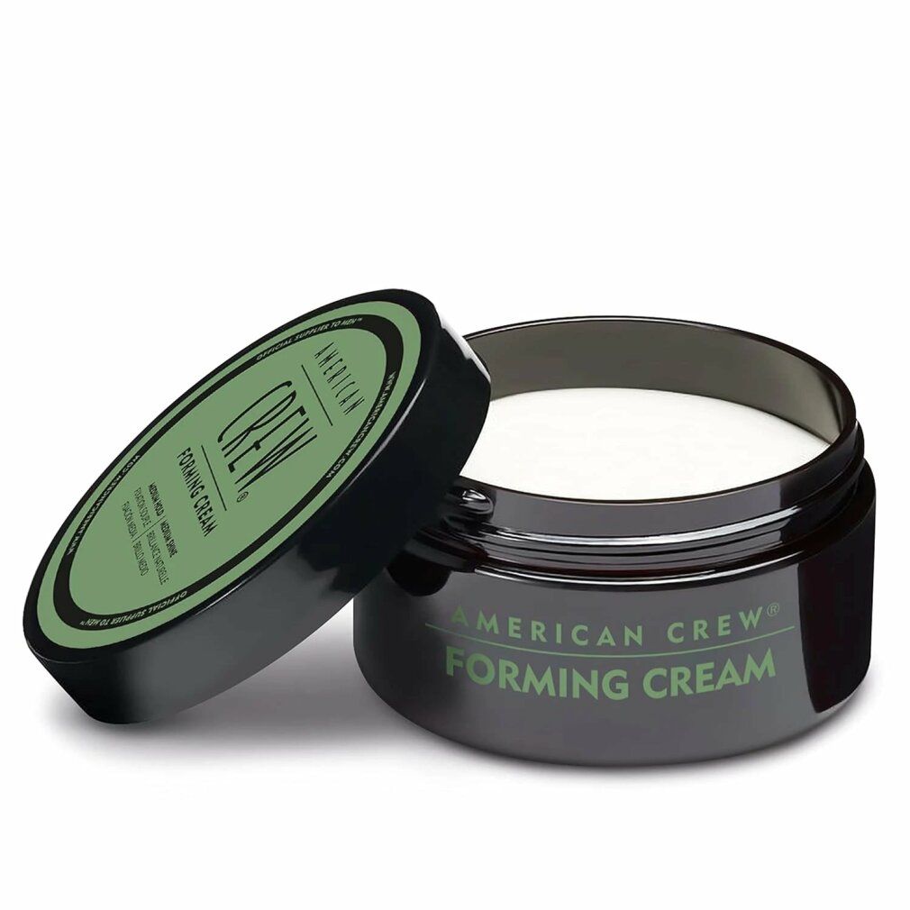 Geöffnete Dose mit schwarzem Deckel und grünem Etikett. Produktname: Forming Cream. Der Inhalt ist weiß. Der Deckel liegt daneben.