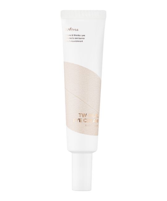 Weiße Tube mit Aufschrift TW REAL EYE CREAM. Beige Musterung. Produktname und Marke deutlich sichtbar.