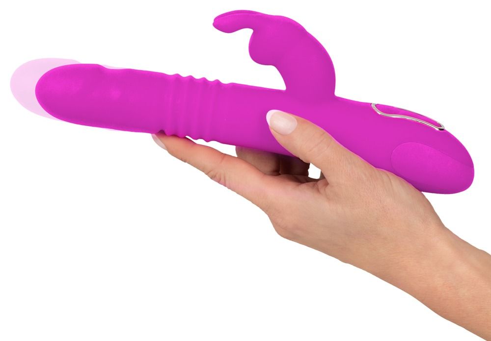 Lila Vibrator mit Hasenohren-Design, in Hand gehalten. Glatte Oberfläche, geriffelte Textur.