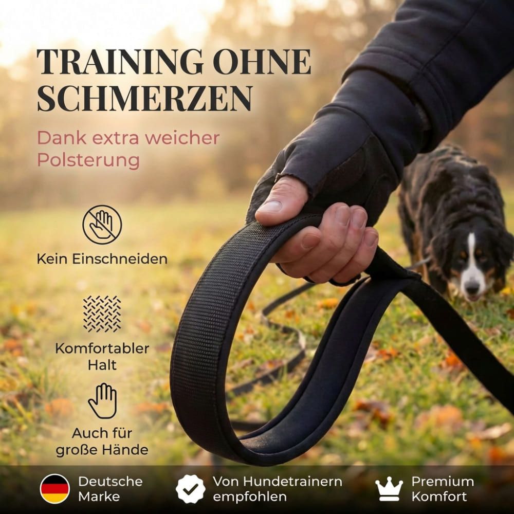Schwarze Schleppleine mit gepolsterter Handschlaufe. Text: "Training ohne Schmerzen". Deutsche Marke, empfohlen von Hundetrainern.