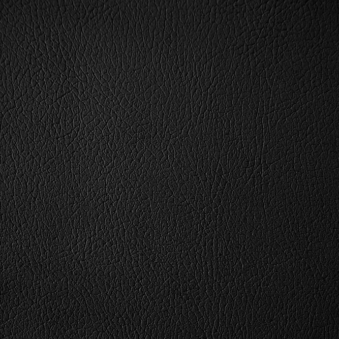 Detailansicht der schwarzen Kunstlederstruktur. Die Oberfläche ist leicht strukturiert.