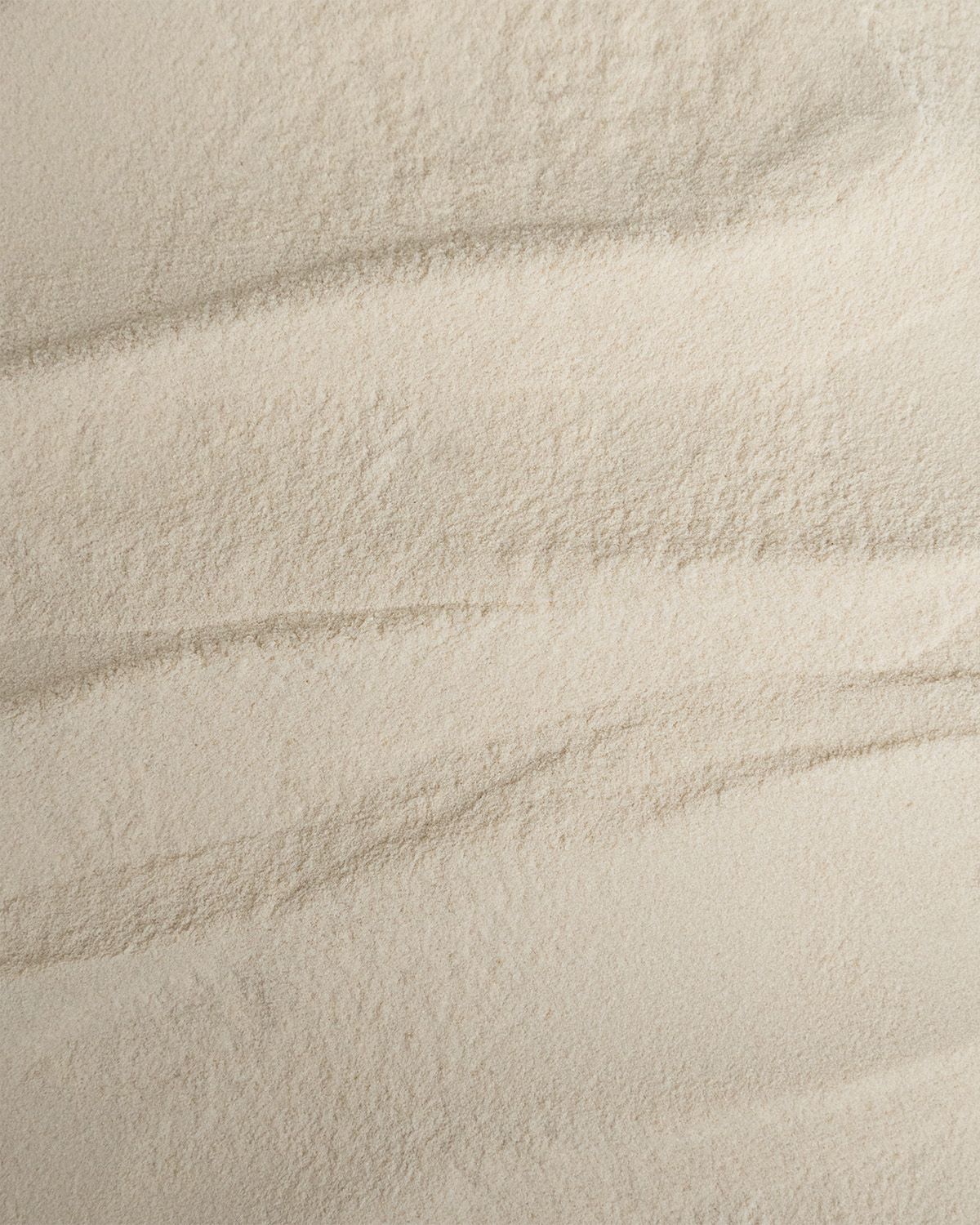 Textur von feinem Agar Agar Pulver mit sanften Wellen.