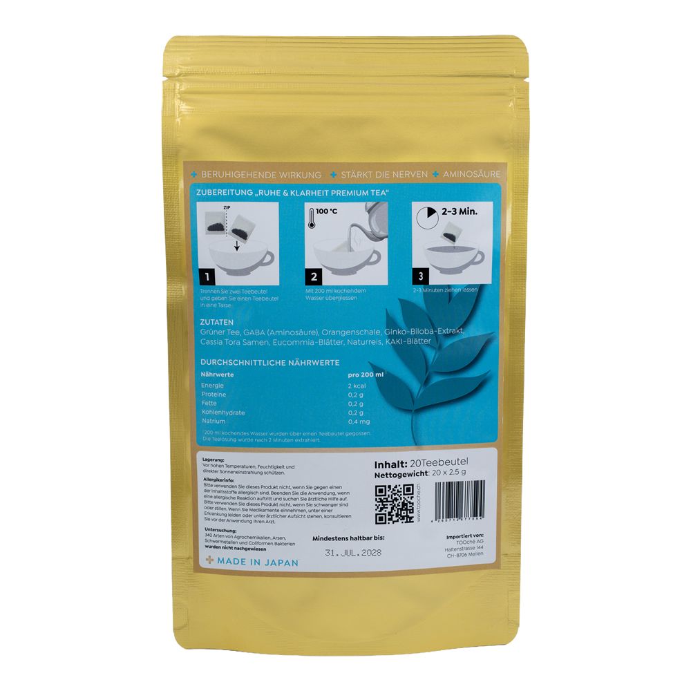 Rückseite der goldfarbenen Verpackung. Enthält Informationen zu Zutaten, Nährwerten und Zubereitung. Text: "Ruhe & Klarheit Premium Tea".