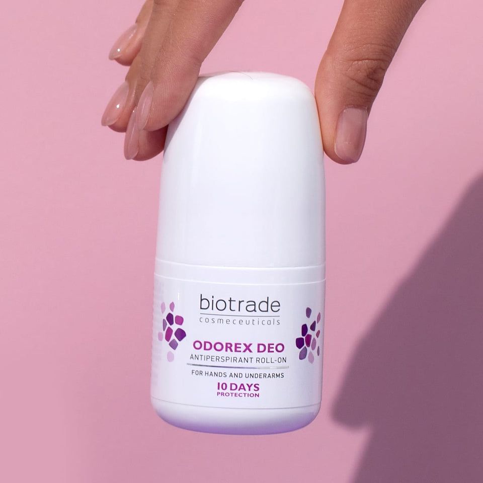 Weißer Roll-On-Deo mit lila Akzenten. Aufschrift: Biotrade, Odorex Deo, Antitranspirant Roll-On. Für Hände und Achseln. 10 Tage Schutz.