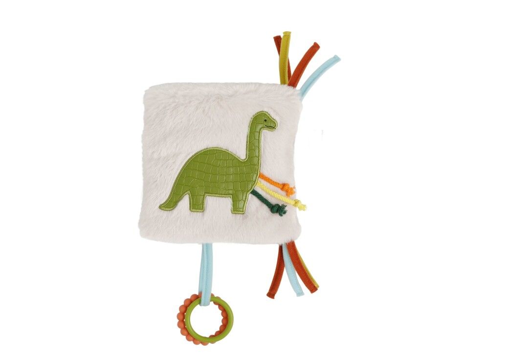 Quadratisches Stoffbuch mit grünem Dino-Motiv. Bunte Bänder und Ringe zum Greifen. Flauschiges Material.