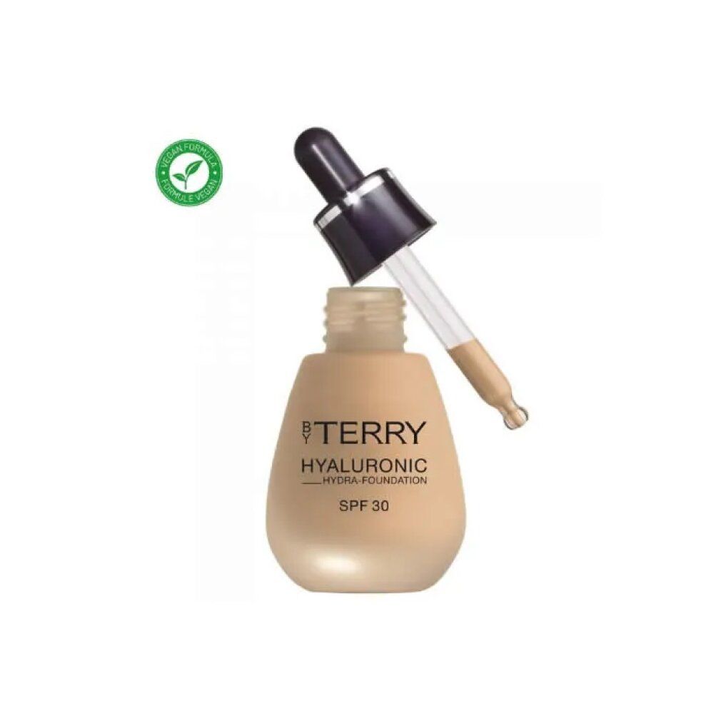 Beige Foundation-Flasche mit Tropfer. Aufschrift: BY TERRY, HYALURONIC HYDRA-FOUNDATION, SPF 30. Mit Bio-Siegel.