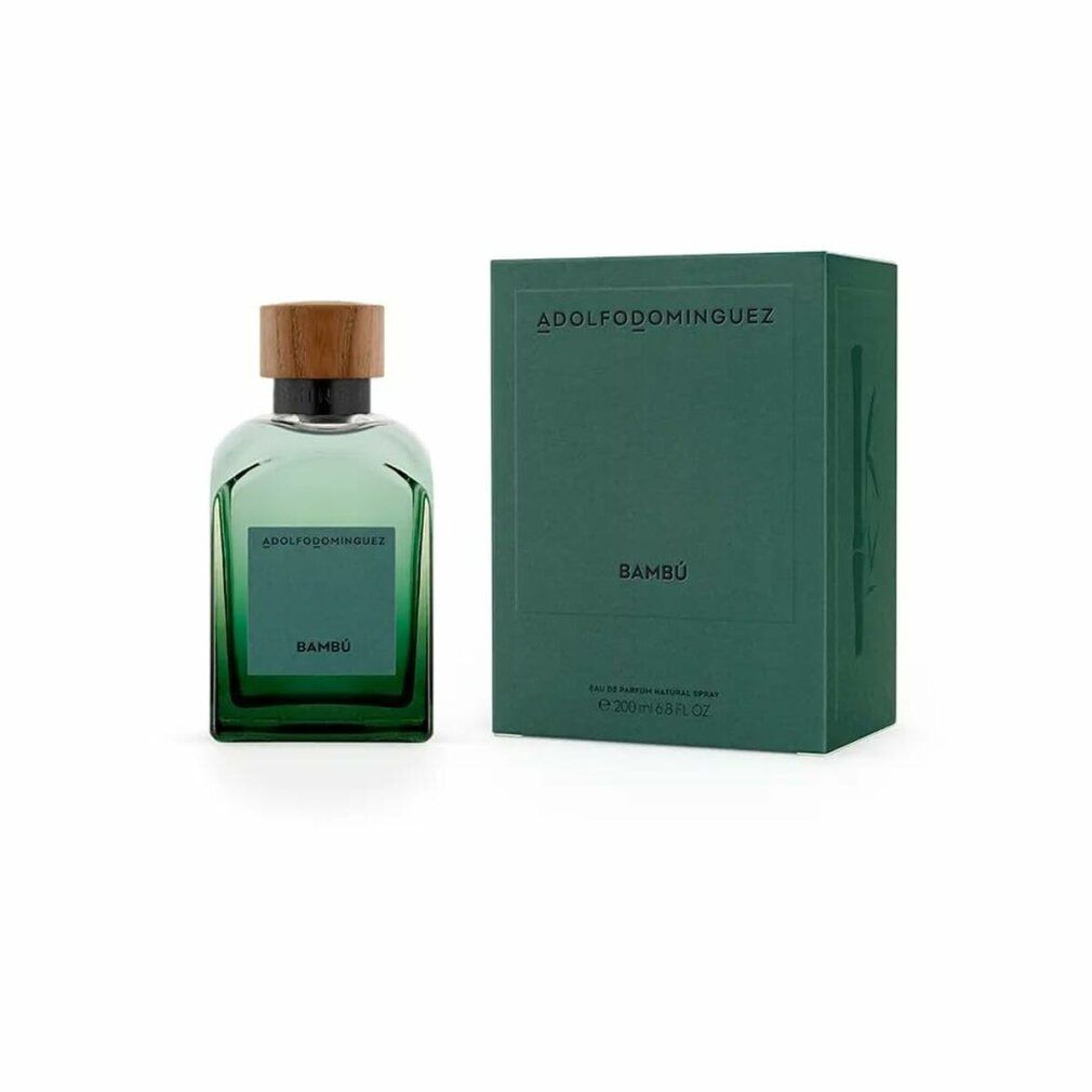 Grüne Glasflasche mit Holzdeckel und grüner Verpackung. Auf der Flasche steht "Bambú". Die Verpackung trägt den Namen "ADOLFO DOMINGUEZ".
