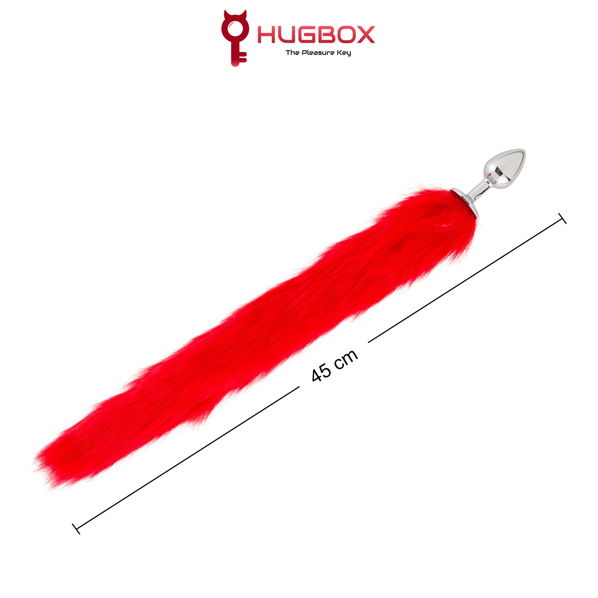Roter, pelziger Schwanz mit Metallbasis. Aufschrift: 45 cm. Logo: HUGBOX The Pleasure Key.