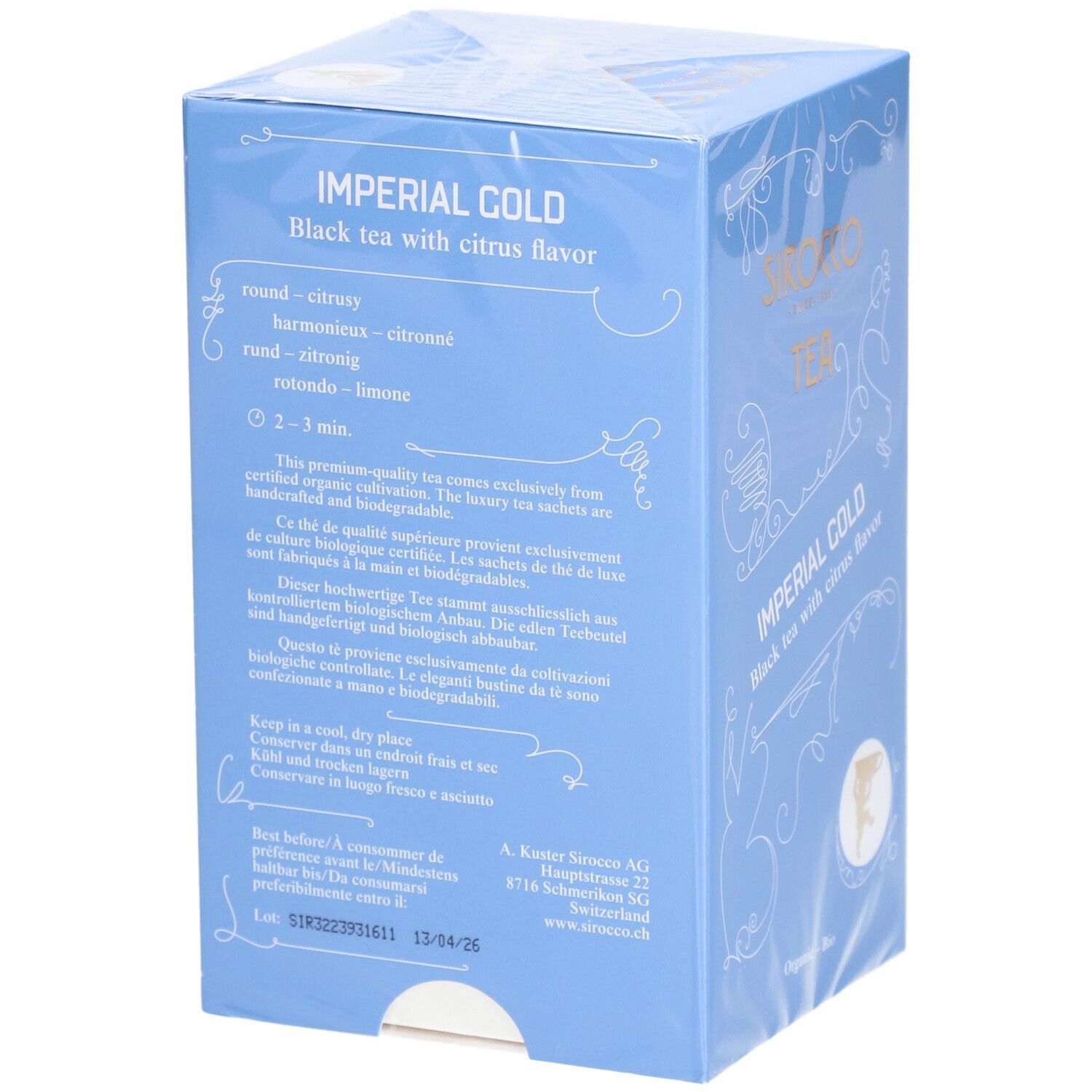 Hellblaue Schachtel mit Texten. "Imperial Gold Black tea with citrus flavor". Zubereitungshinweise, Haltbarkeit. Verpackt in Folie.