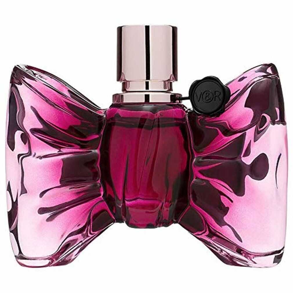 Parfümflasche in Schleifenform. Rosa Glasflasche mit silbernem Verschluss. Schwarzes Siegel mit Logo.