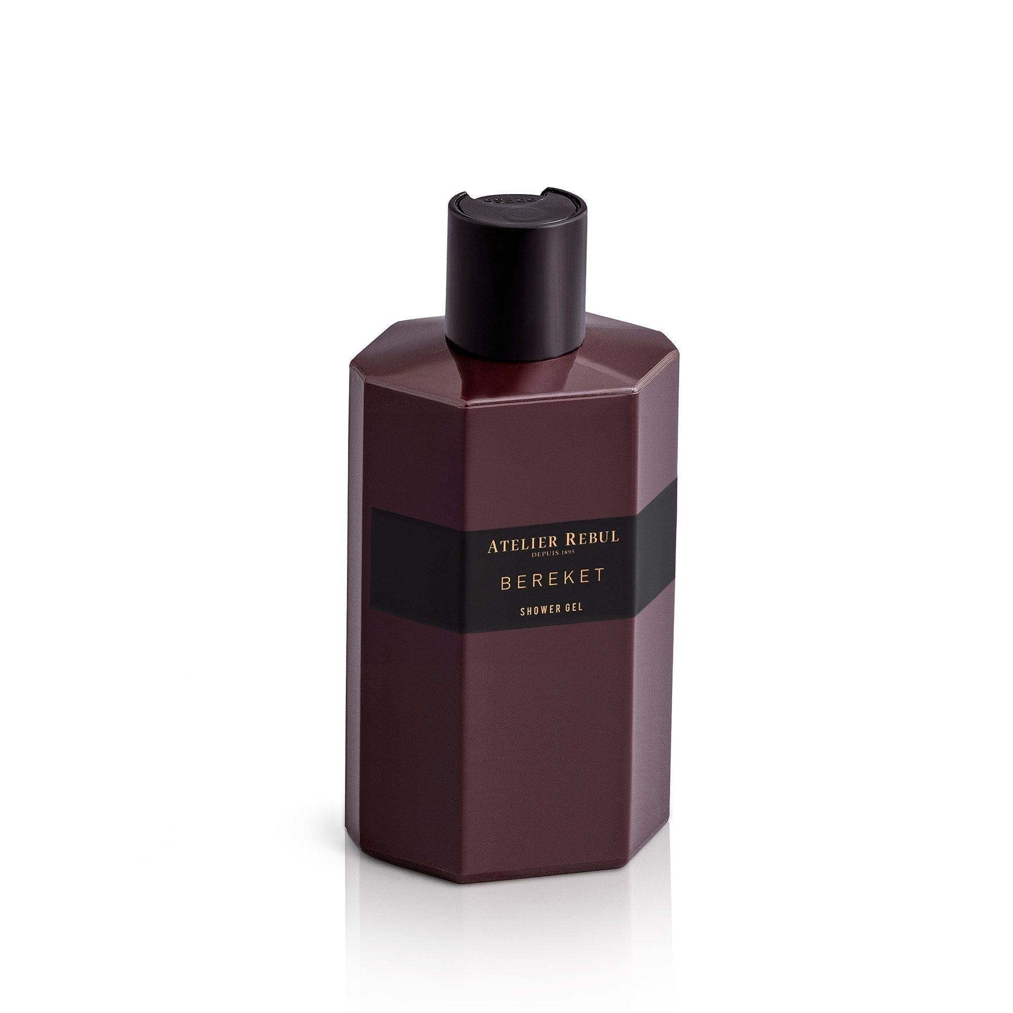 Bordeauxfarbenes Duschgel mit schwarzem Deckel. Aufschrift: Atelier Rebul Bereket. Geometrische Form.