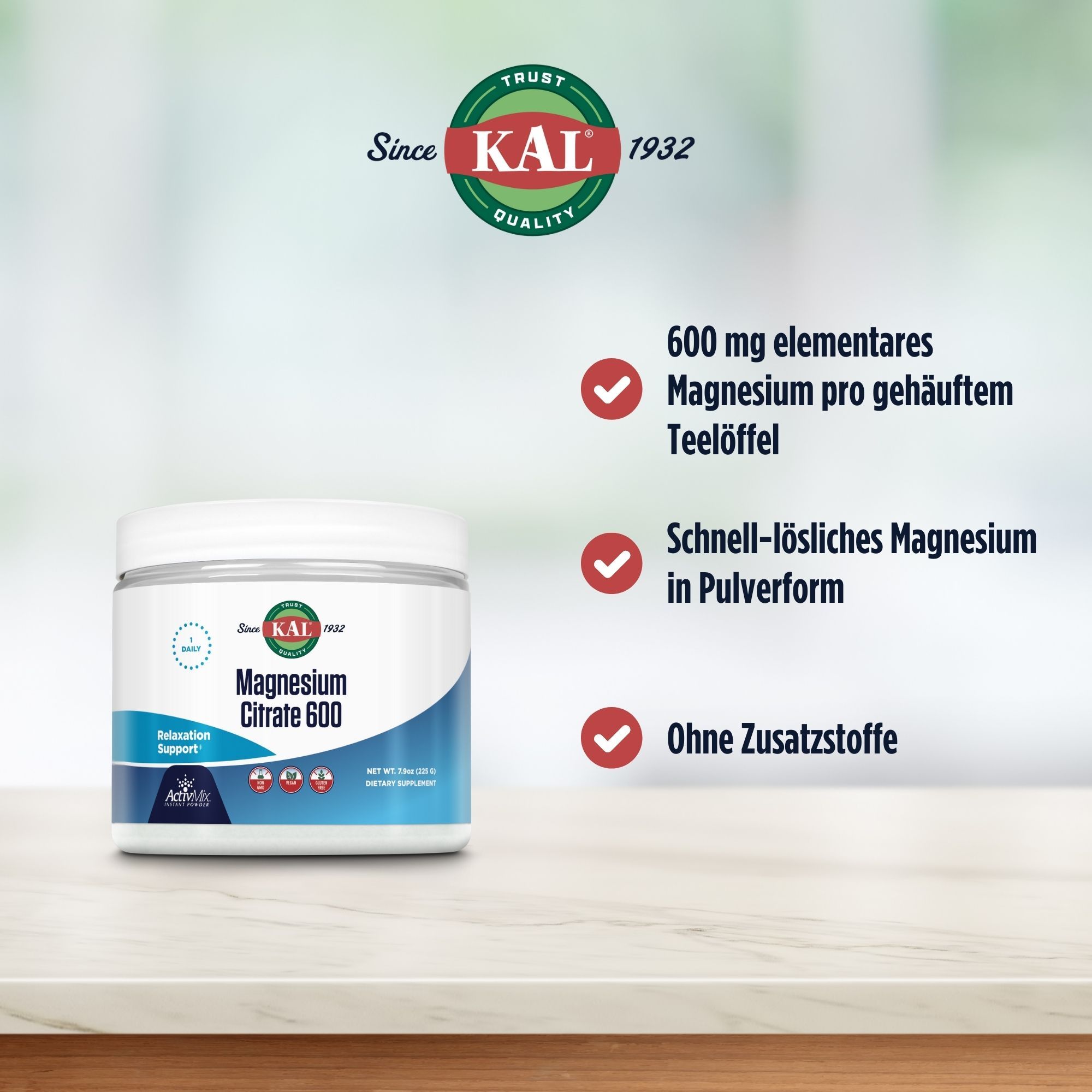 Weißes Produktglas mit blauem Etikett. Aufschrift: Magnesium Citrat 600. Text: 600 mg Magnesium pro Teelöffel.