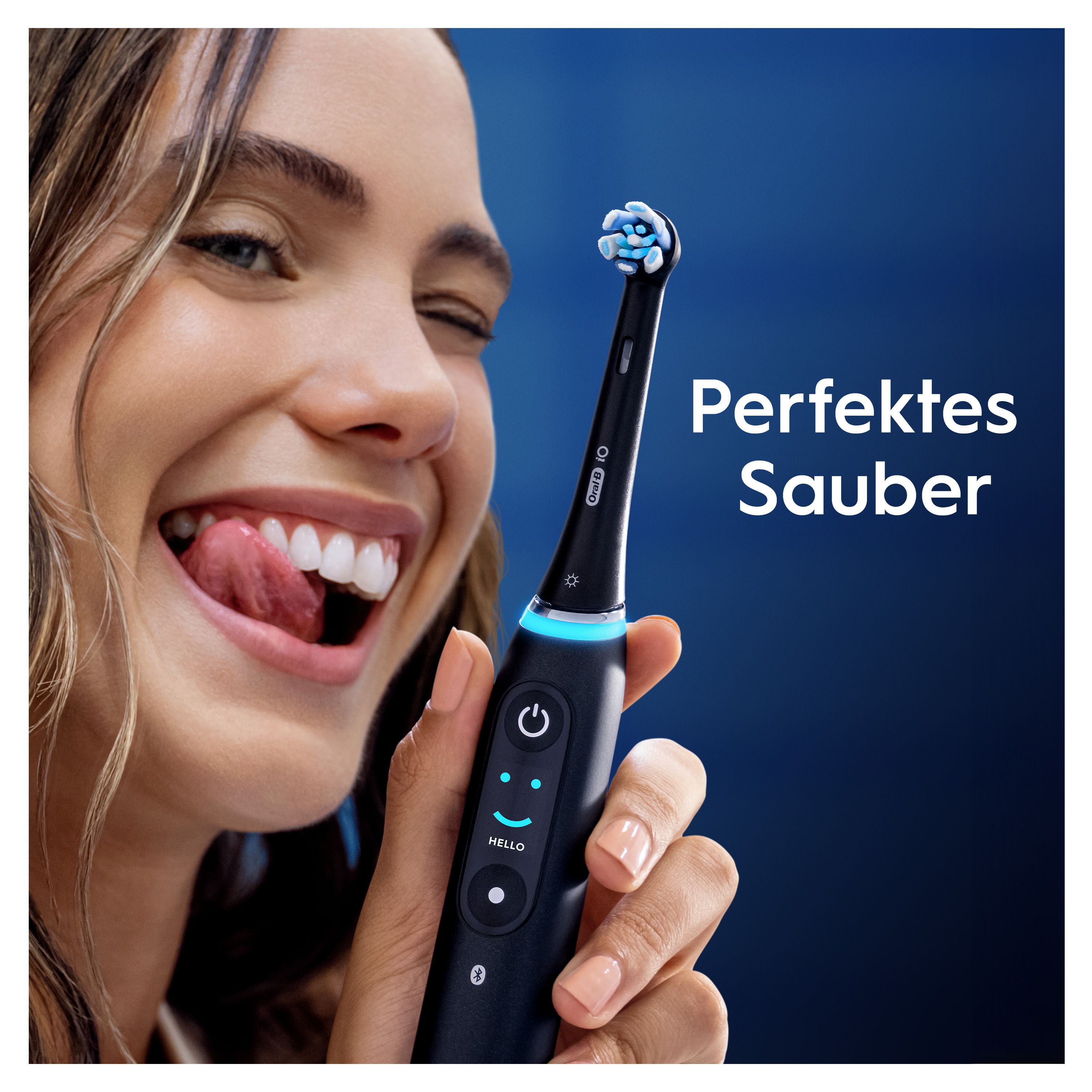 Person hält eine schwarze elektrische Zahnbürste. Text: Perfektes Sauber.