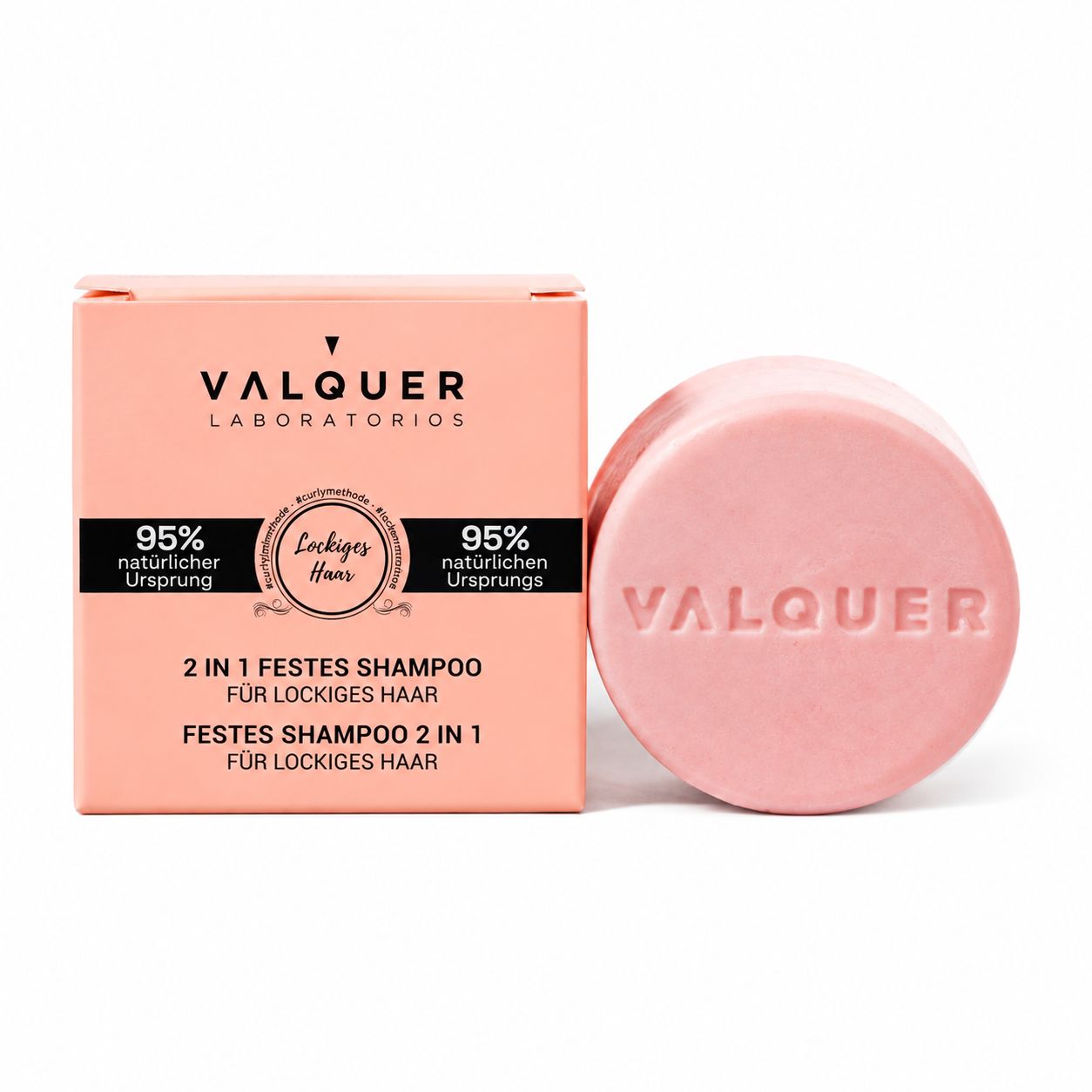 Verpackung und ein rundes, rosa Seifenstück mit der Aufschrift 'VALQUER'.