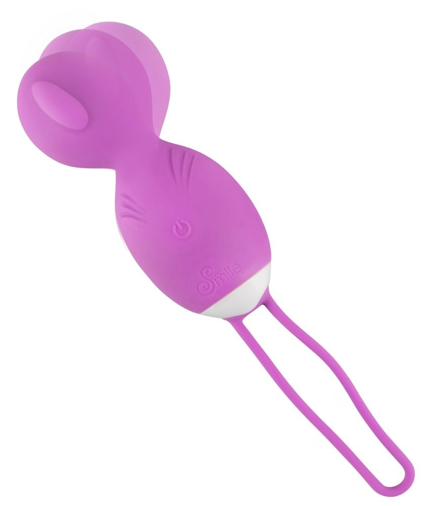 Lila Vibrokugel-Duo. Zwei Kugeln, verbunden mit einem Band. Auf einer Seite ein Knopf. Weißes Detail am Übergang.