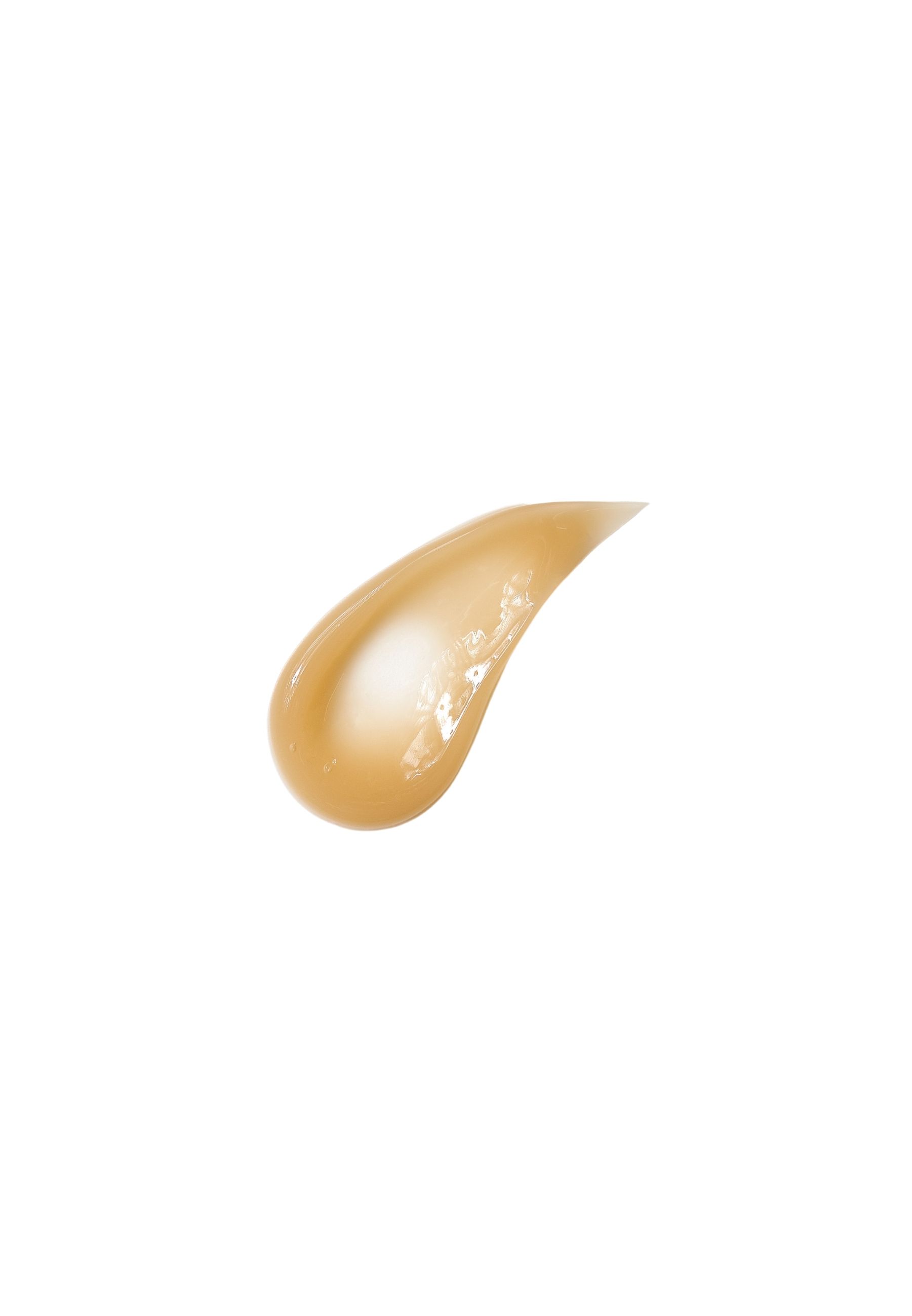 Klecks einer gelblichen Creme auf weißem Hintergrund. Konsistenz sichtbar.