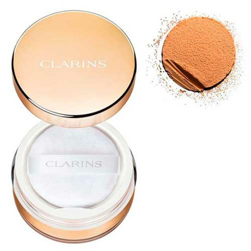 Clarins Puder in einem goldenen Behälter mit weißem Puderquaste.