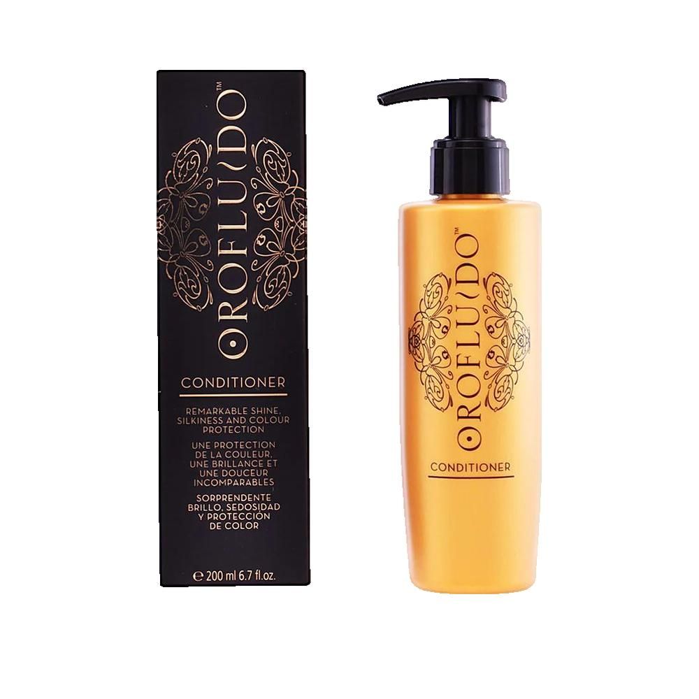Orofluido Conditioner-Flasche und Verpackung. Goldfarbene Flasche mit schwarzem Pumpkopf. Schwarze Verpackung mit Goldmuster.