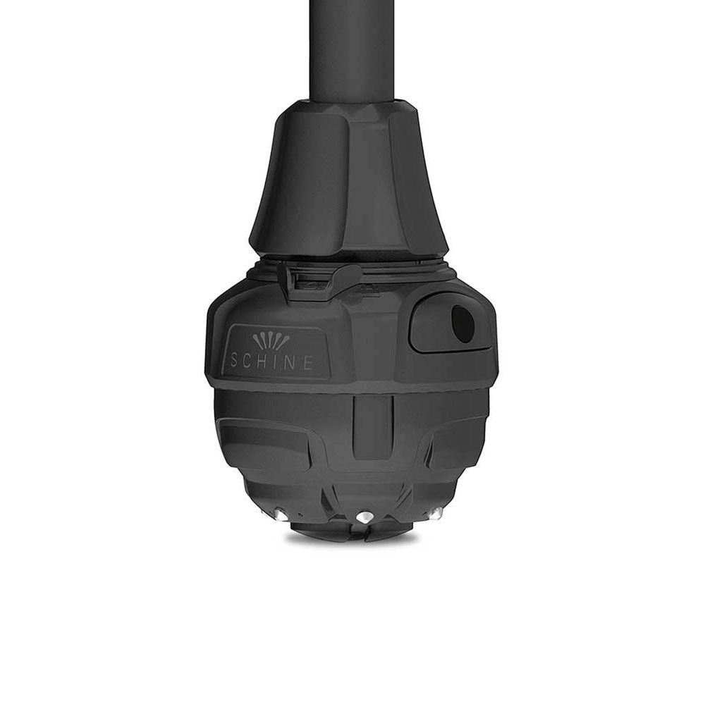 Schwarzer Krückenfuß mit Spikes. Aufschrift: SCHINE. Runde Form mit mehreren Elementen. Unterseite mit Spikes.