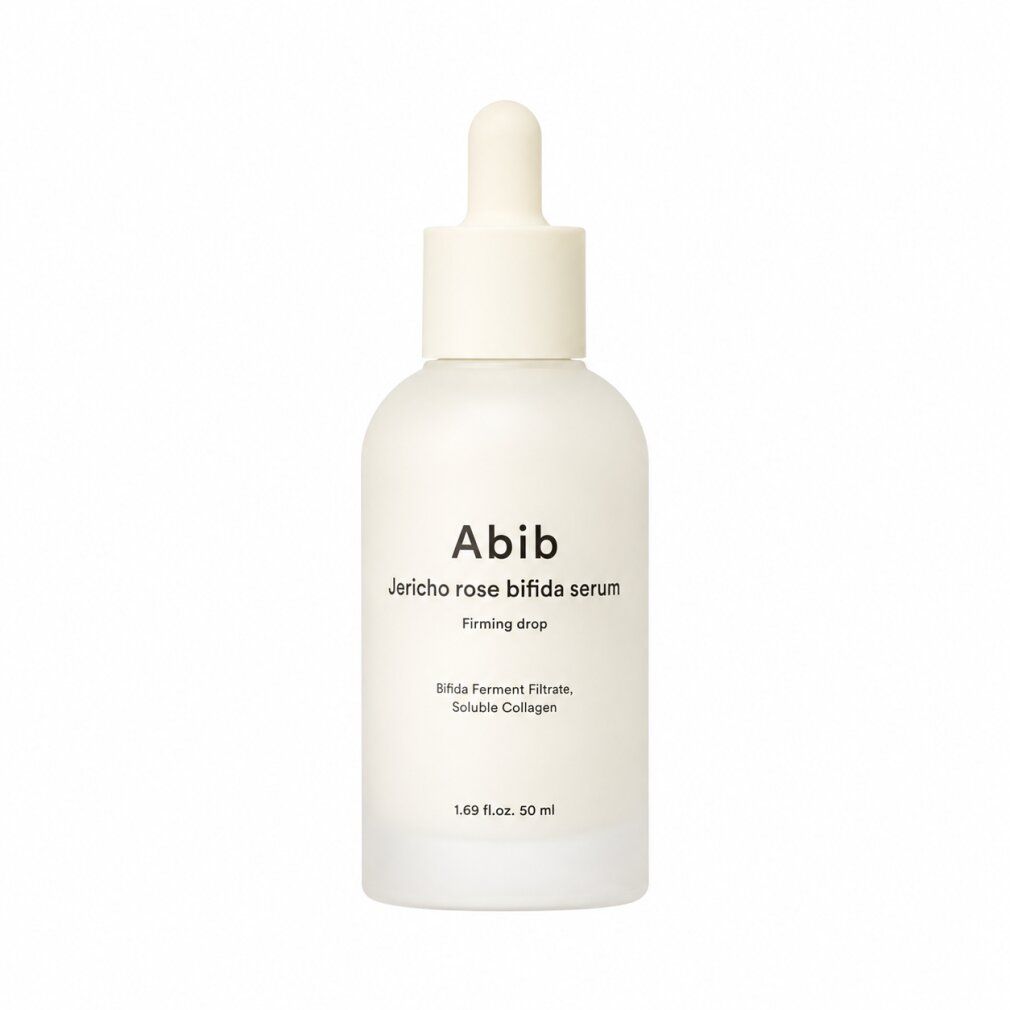 Abib Jericho Rose Bifida Serum Flasche mit Pipettenverschluss. Milchiges Glas mit weißem Etikett.