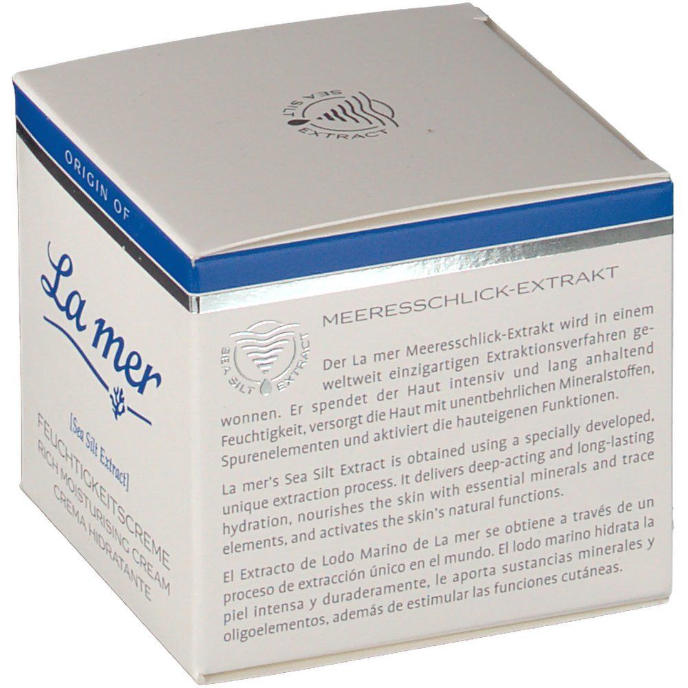 Weißer Karton mit blauem Streifen. Text: La mer, Feuchtigkeitscreme, Meeresschlick-Extrakt. Produktinformationen in Deutsch, Englisch und Spanisch.