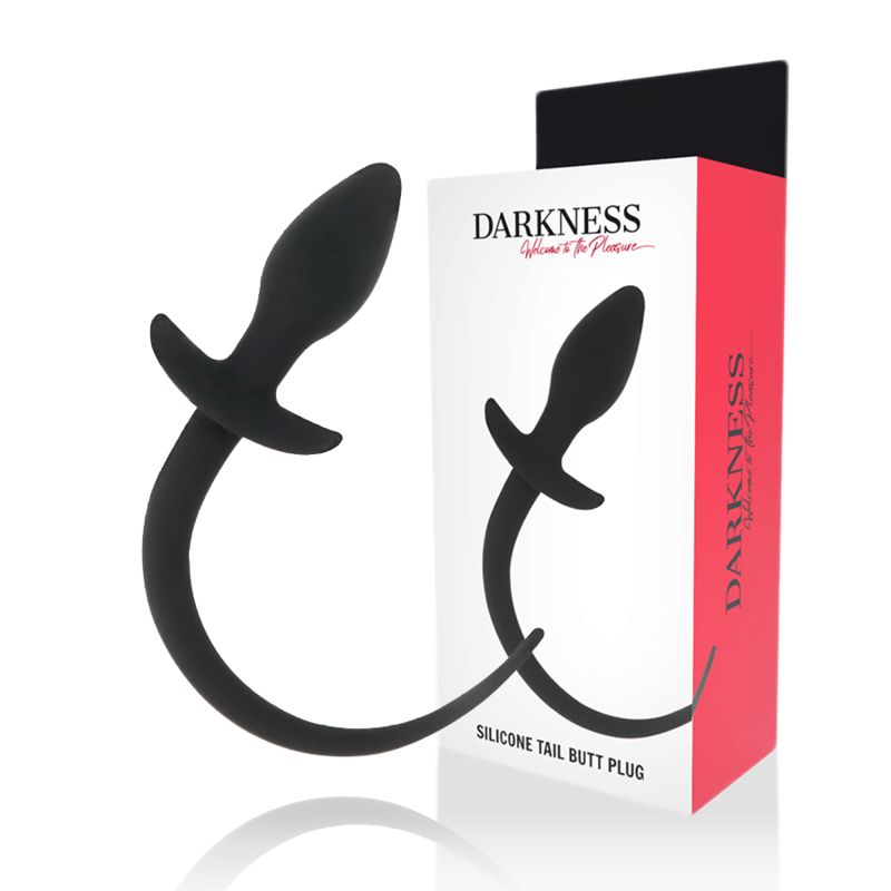 Zwei schwarze Silikon-Analdilatatoren vor der Produktverpackung. Aufschrift: "DARKNESS". Text: "SILICONE TAIL BUTT PLUG".