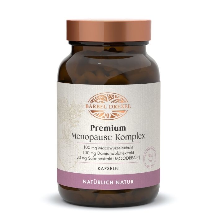 Braune Glasflasche mit braunem Schraubverschluss, gefüllt mit Kapseln. Das Etikett zeigt "Bärbel Drexel Premium Menopause Komplex".