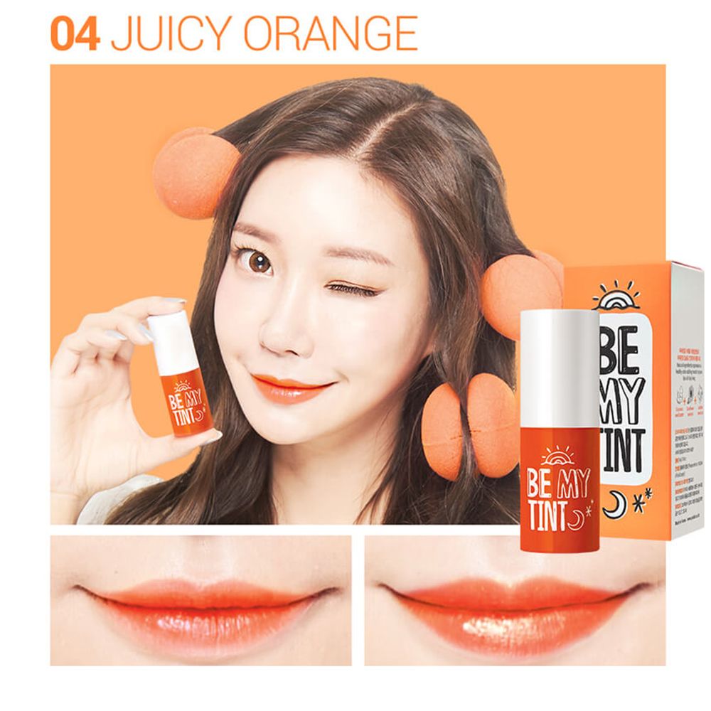 Frau mit orangefarbenem Lippen-Tint. Produkt und Verpackung sind sichtbar. Aufschrift: BE MY TINT.