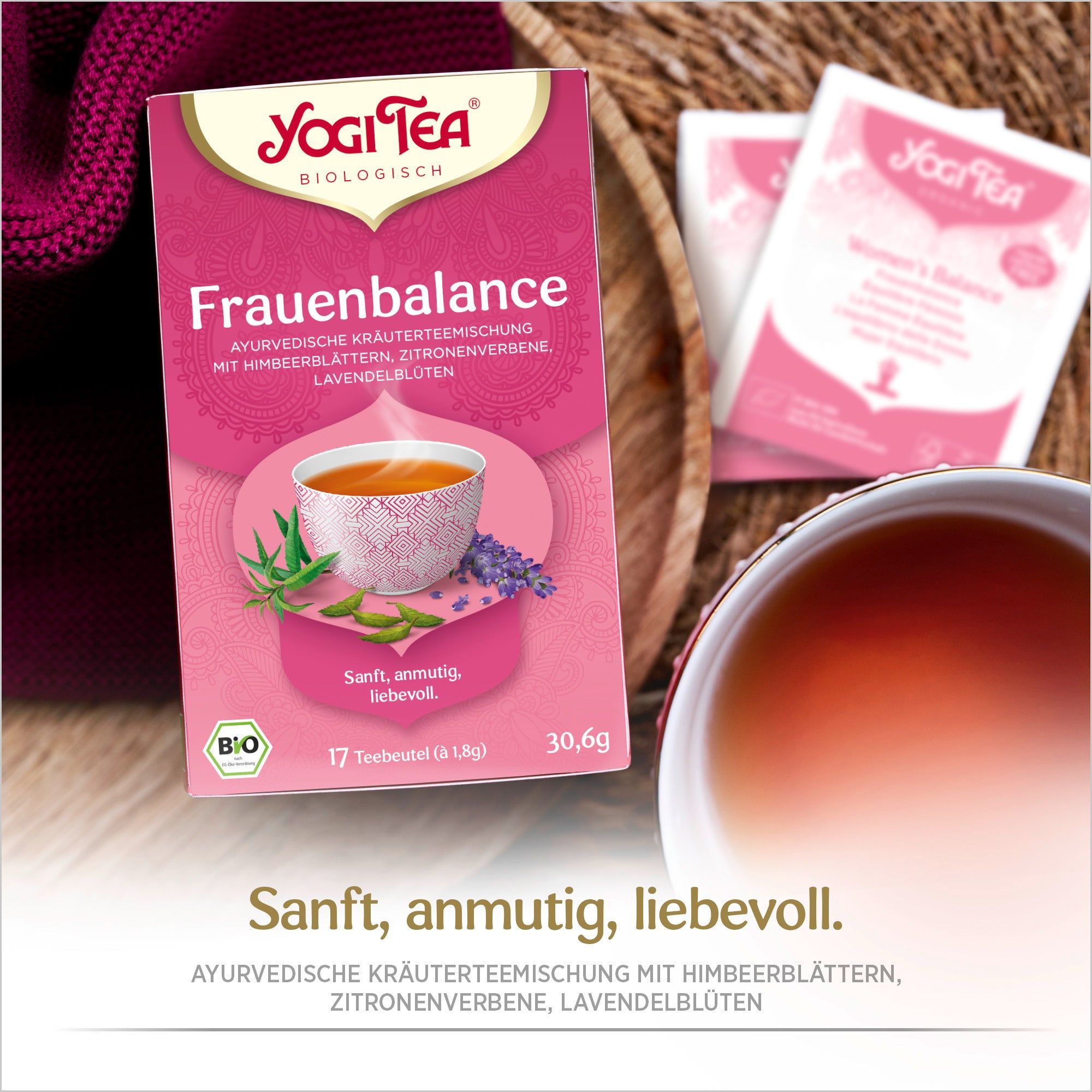 Yogi Tea Frauen Balance Bio Kräutertee Packung. Rosa Verpackung mit Logo und Produktbezeichnung. Bio-Siegel. Teebeutel daneben.