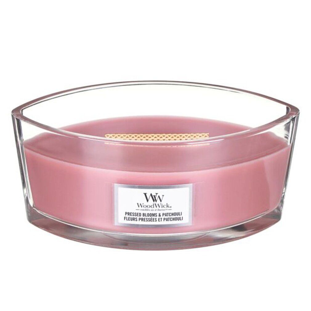 Rosa Kerze mit Holzdocht in Glasbehälter. Label mit "WoodWick" und Produktbezeichnung.