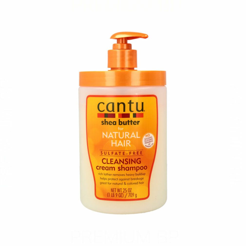 Shampoo-Flasche mit Pumpverschluss. Aufschrift: Cantu, Shea Butter, für Natural Hair, Cleansing Cream Shampoo. Orange und Weiß.