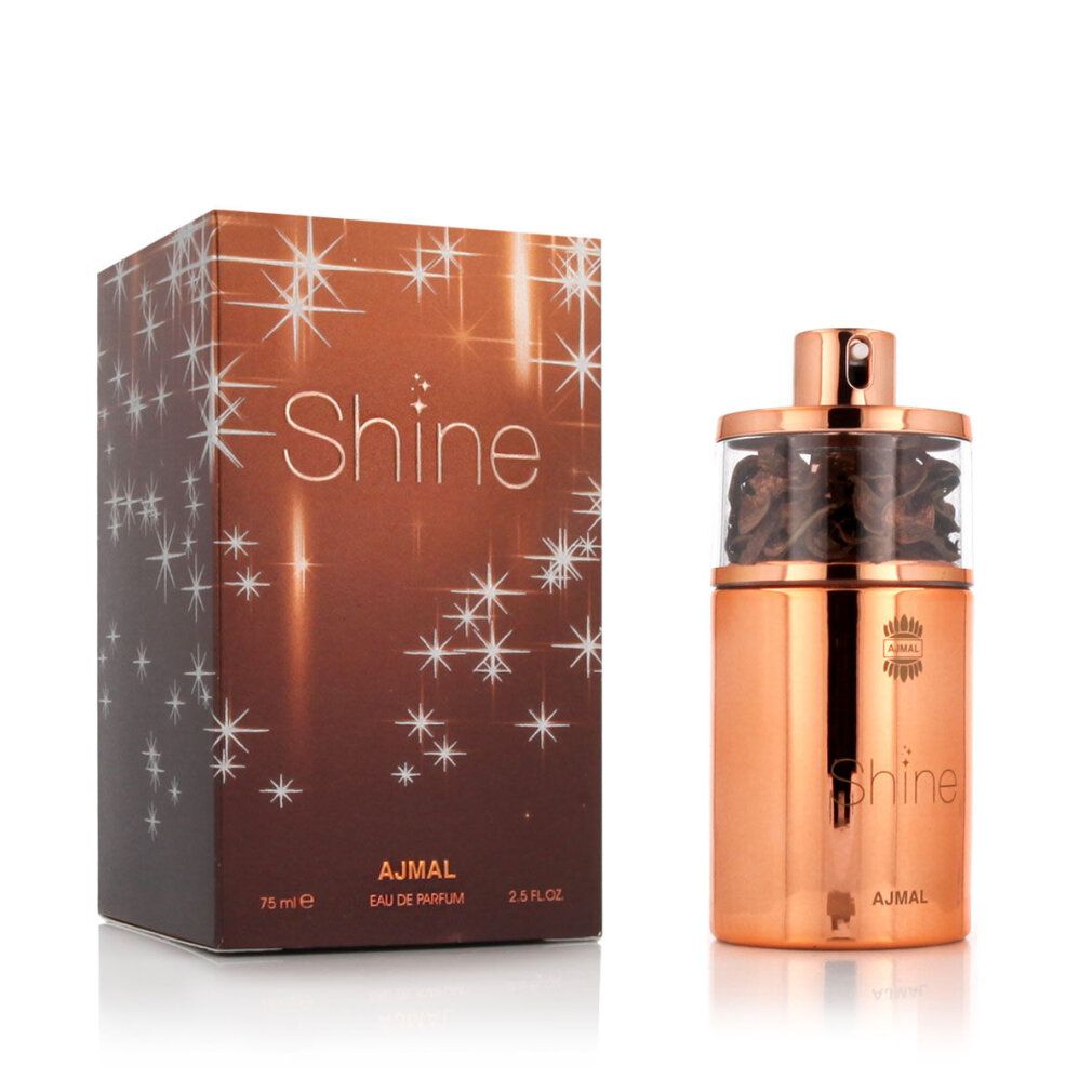 Parfümflasche und Schachtel. Flasche aus Metall, goldfarben, mit Glasaufsatz. Schachtel mit Sternenmuster und Aufschrift Shine.