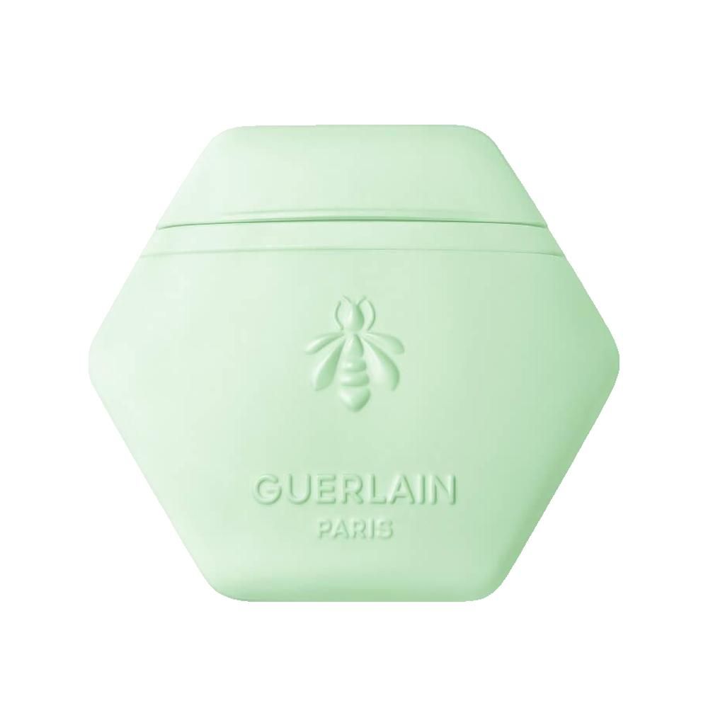 Hellgrüner, sechseckiger Behälter mit geprägter Biene und Schriftzug Guerlain Paris.
