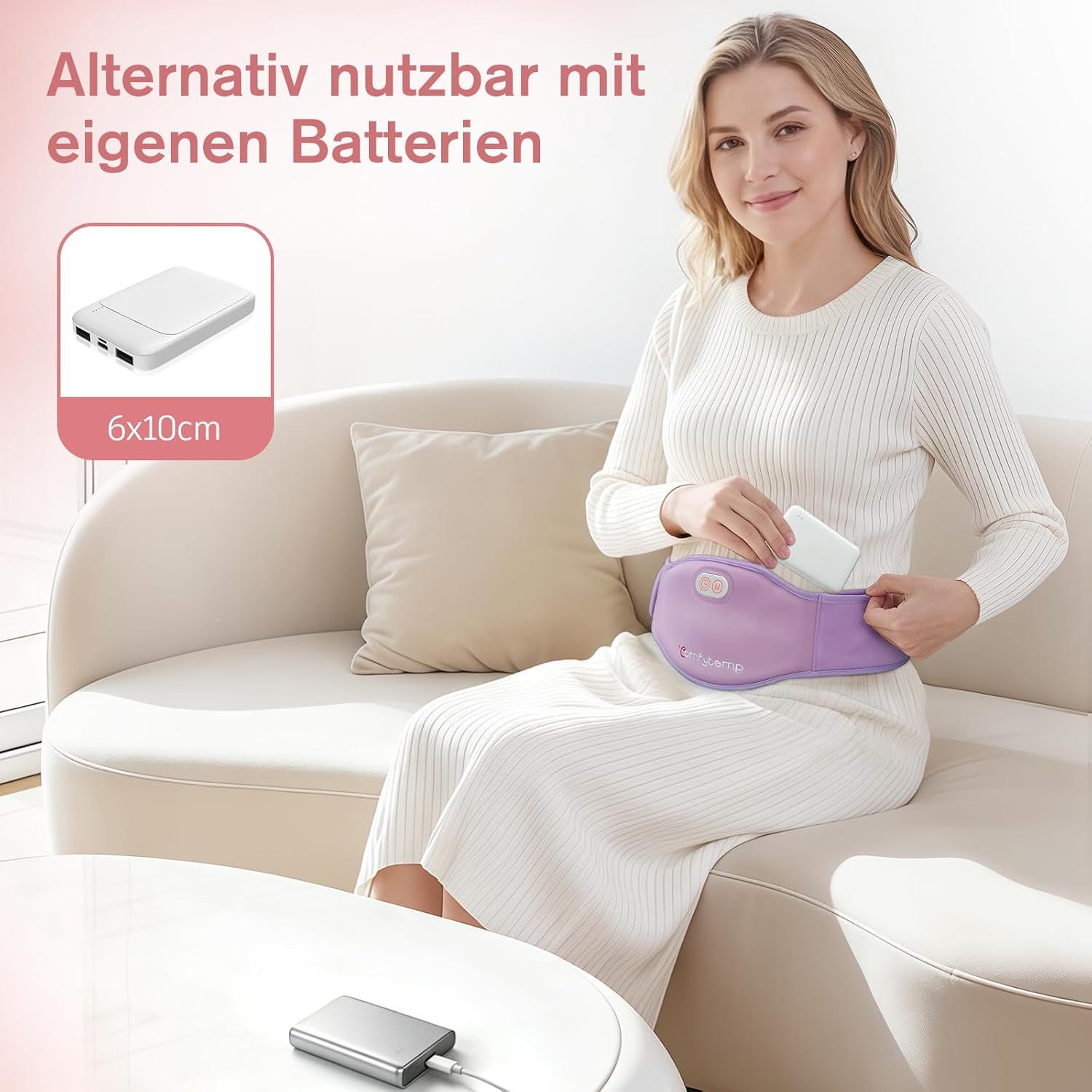 Frau mit lila Heizgürtel, der mit einer Powerbank betrieben wird. Größe der Powerbank: 6x10cm.
