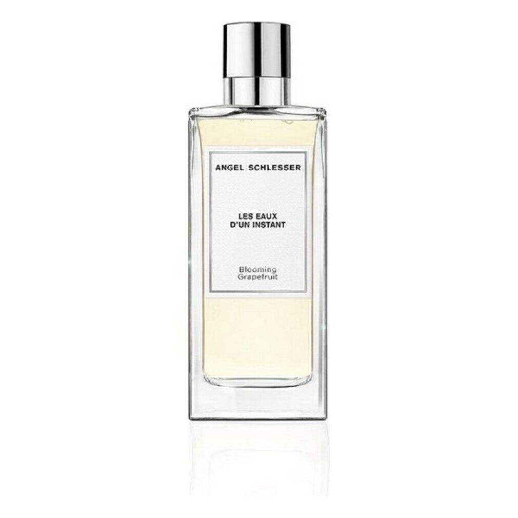 Rechteckige Glasflasche mit silbernem Verschluss. Aufschrift: Angel Schlesser, Les Eaux d'Un Instant, Blooming Grapefruit.