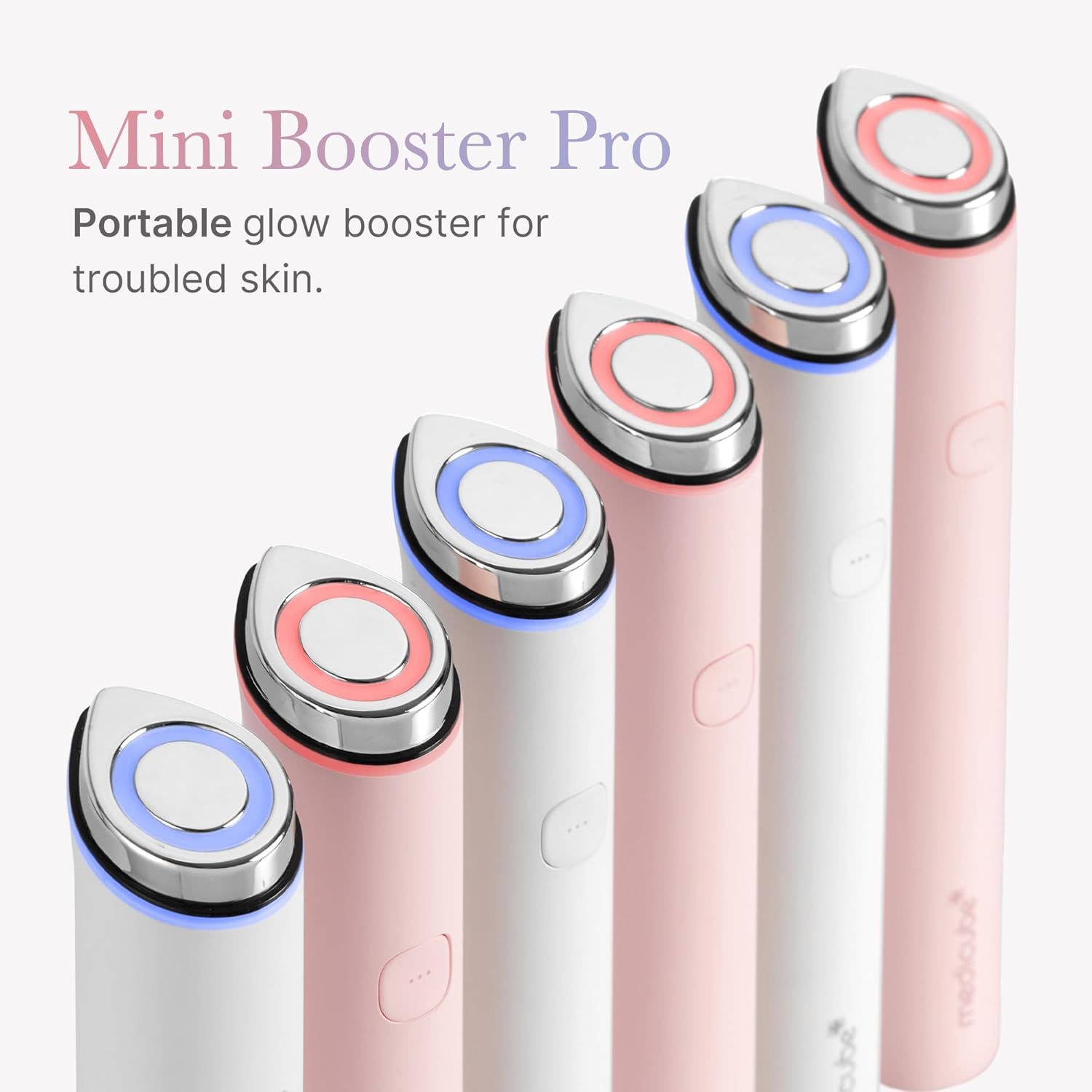 Mehrere Booster Pro Mini in verschiedenen Farben. Runde Spitzen mit farbigem Licht. Logo Medicube sichtbar.