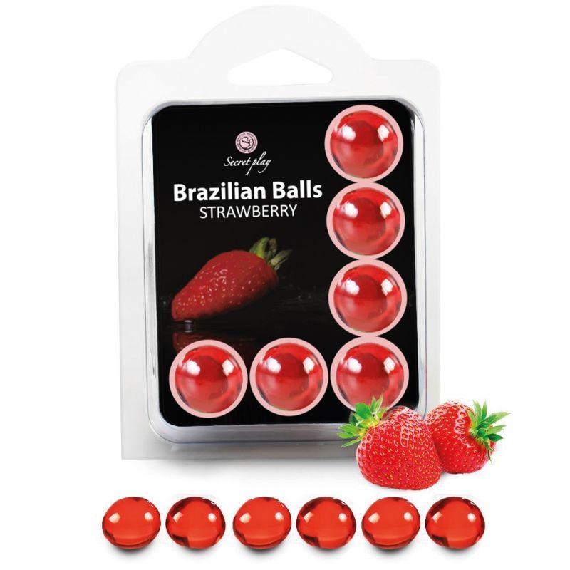 Verpackung mit roten, kugelförmigen Produkten. Aufschrift: Brazilian Balls Strawberry. Daneben Erdbeeren.