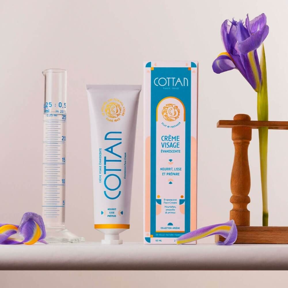 COTAN Creme und Verpackung. Tube und Schachtel. Irisblüte und Messzylinder.