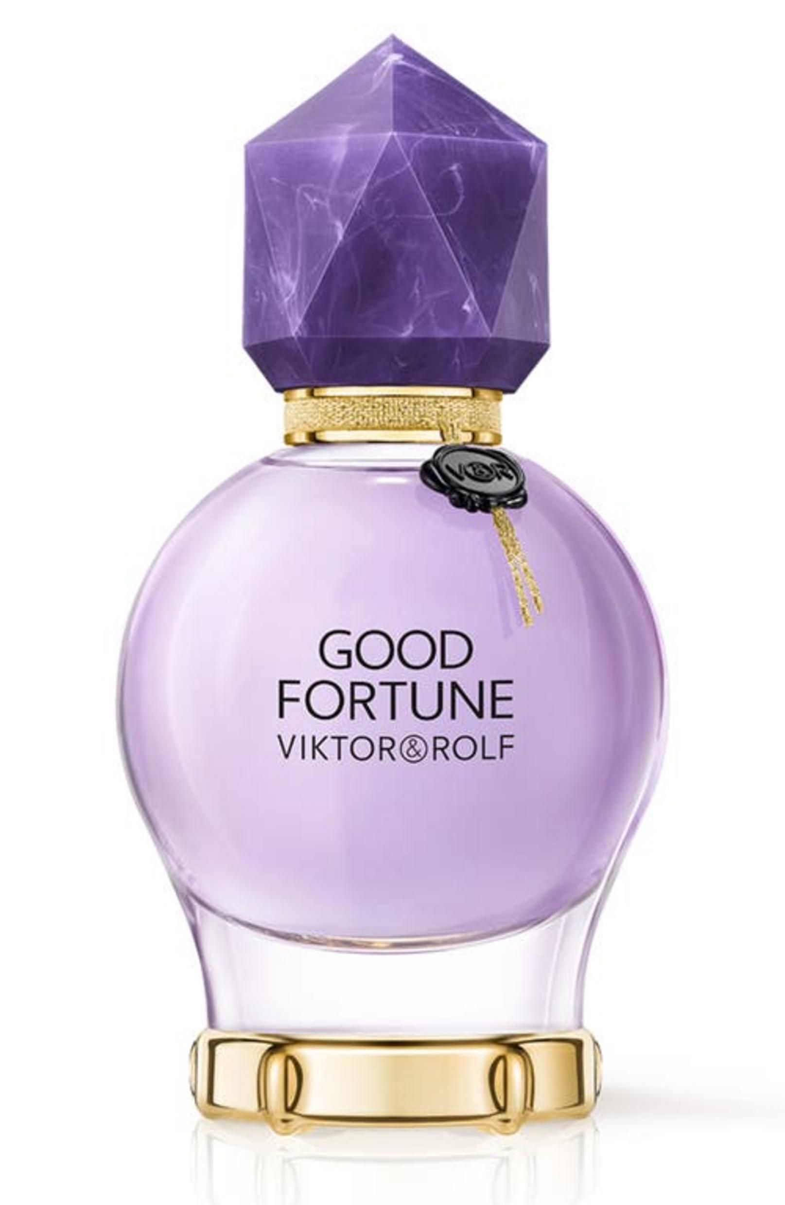 Runder, violetter Flakon mit facettiertem Deckel. Goldener Ring am Hals. Aufschrift: GOOD FORTUNE VIKTOR & ROLF.