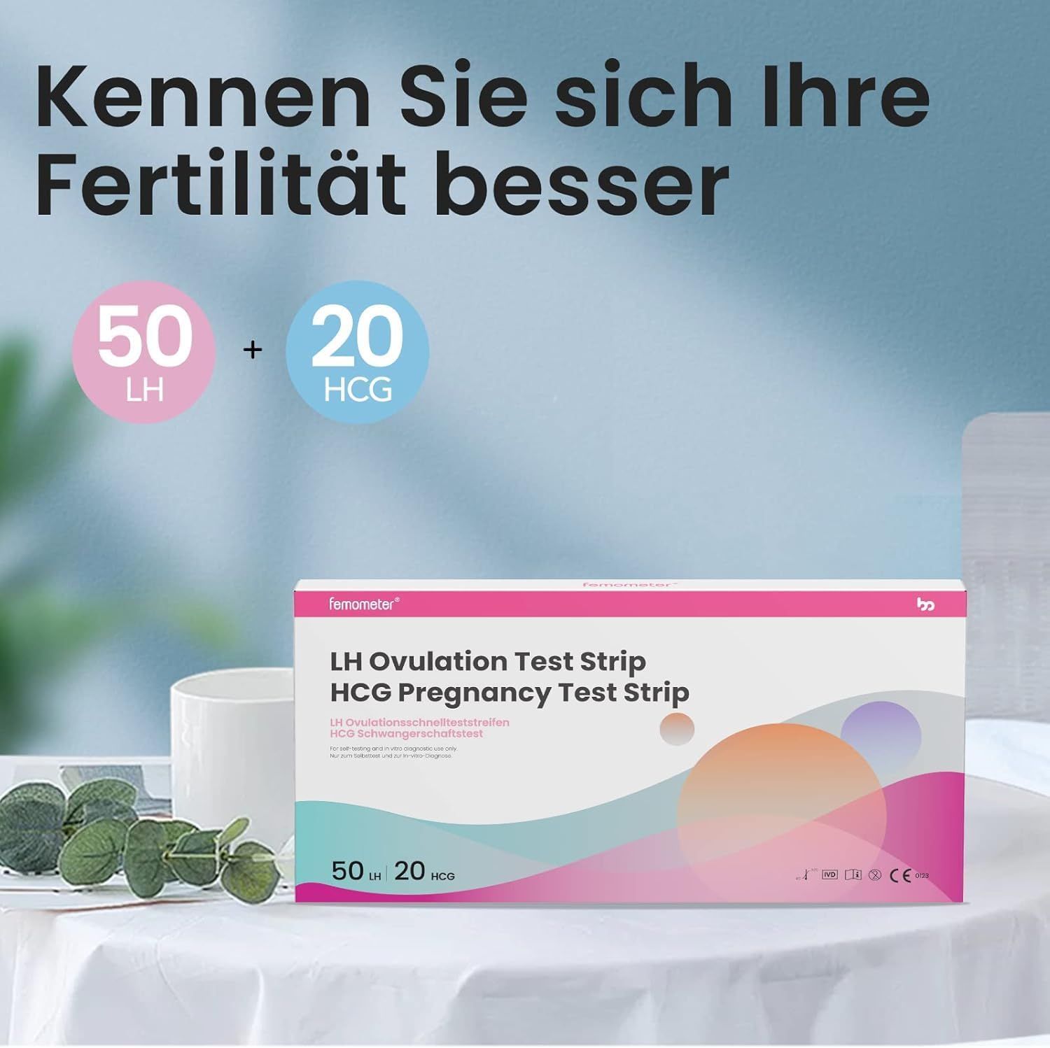 Verpackung mit Teststreifen. Aufschrift: LH Ovulation Test Strip, HCG Pregnancy Test Strip. 50 LH, 20 HCG. Weißer Becher.
