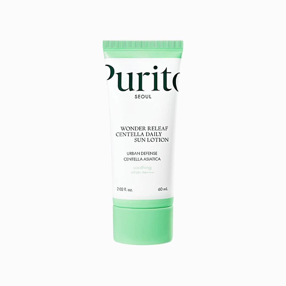 PURITO Wonder Releaf Centella Daily Sun Lotion. Weiße Tube mit grünen Akzenten. Text: Urban Defense, Centella Asiatica, SPF 50.