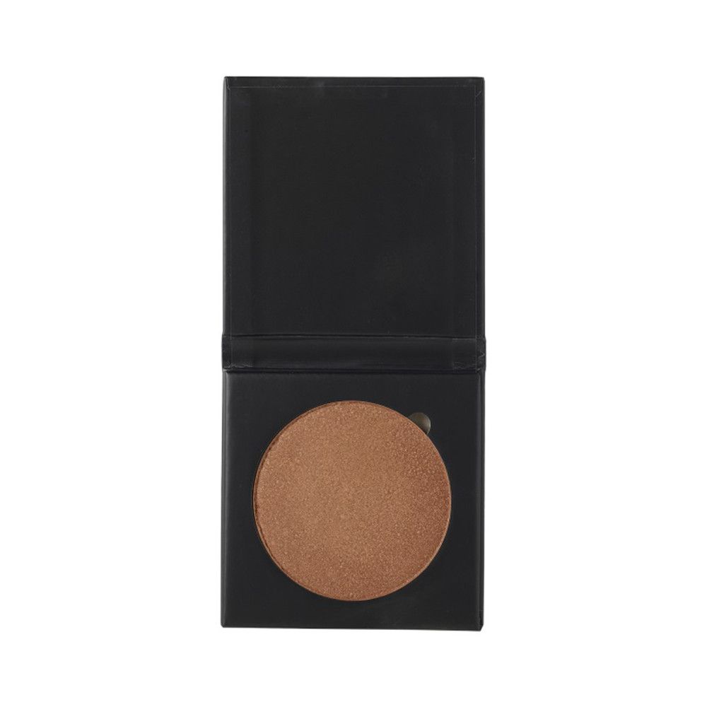 Highlighter in schwarzer, quadratischer Verpackung. Runde, bronzefarbene Textur sichtbar.