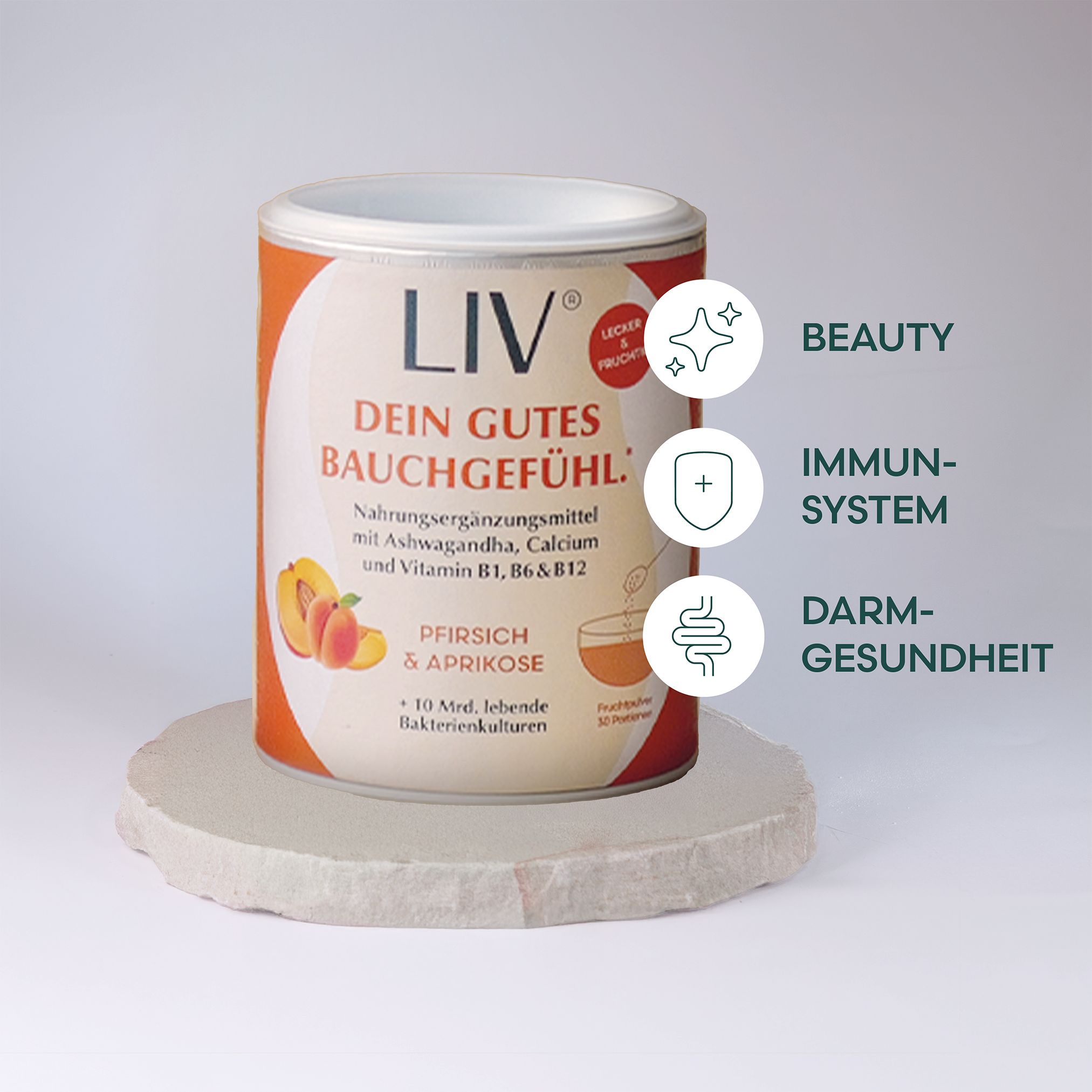 Dose auf Podest. Text: Dein gutes Bauchgefühl. Nahrungsergänzungsmittel. Pfirsich & Aprikose. 10 Bakterienkulturen.