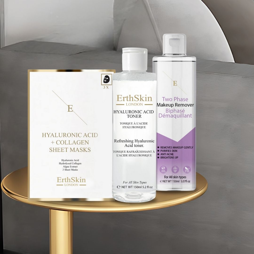 ErthSkin London Produkte auf goldenem Tisch. Hyaluron-Toner, Make-up-Entferner und Kollagenmasken. Weiße Flaschen und Verpackungen.