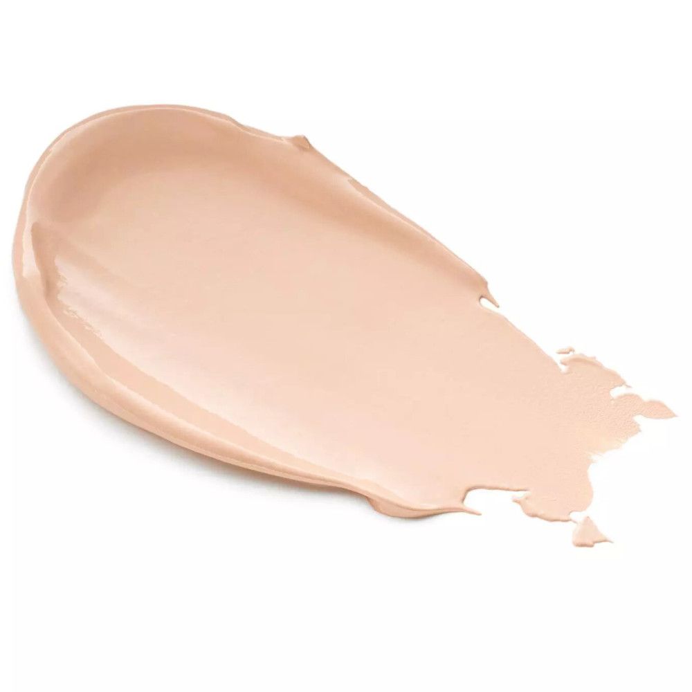 Heller, cremefarbener Farbklecks auf weißem Hintergrund. Die Textur ist glatt und glänzend.