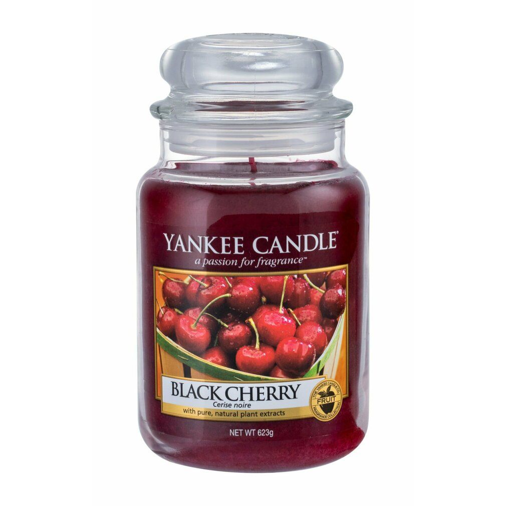 Yankee Candle Duftkerze Schwarze Kirsche. Glasbehälter mit Deckel. Etikett mit Kirschabbildung und Schriftzug.